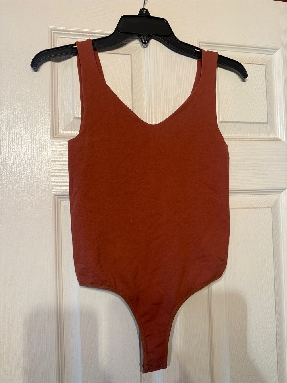 Women’s, mauve/rust One-Piece Bodysuit